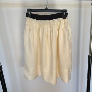 DKNY ecru skirt with black band at waist skirt with pockets size 2